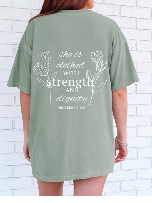 She is clothed in strength and dignity short comfort color sleeve t-shirt